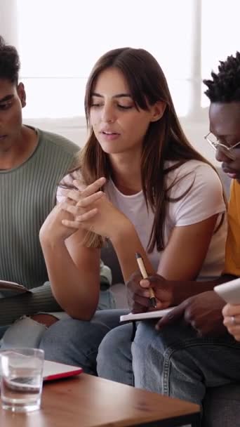 Multiethnic group of college student studying together preparing for exams. Millennial young people working together on laptop for university project. Education and youth concept. Vertical HD video. - Footage, Video
