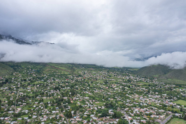 Aerial view on a cloudy day of the town of Mollar in Tucuman Argentina. - Photo, Image