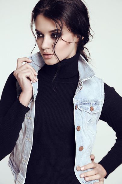 sensual woman with dark  hair and bright makeup, in jeans jacket  - Φωτογραφία, εικόνα