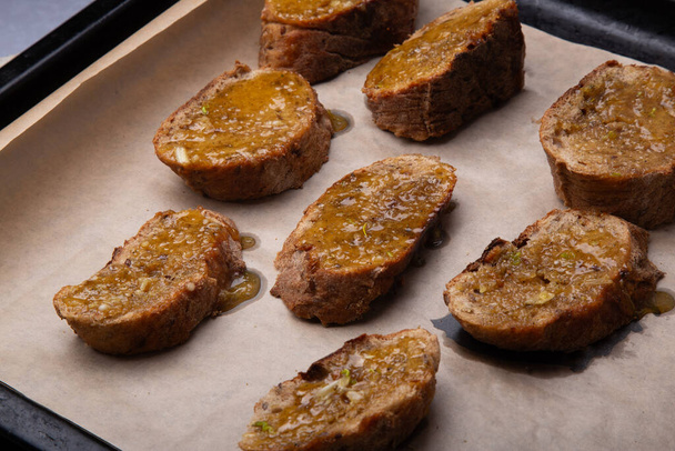 Homemade Honey-Glazed Whole Wheat Toasts on Baking Sheet. - Photo, Image