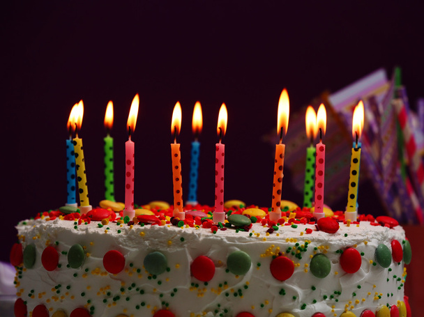 Birthday cake with candles on purple background - Foto, imagen