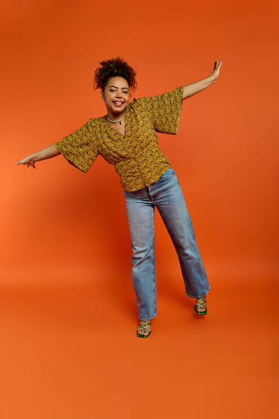 Stylish African American woman posing with outstretched arms - Photo, Image