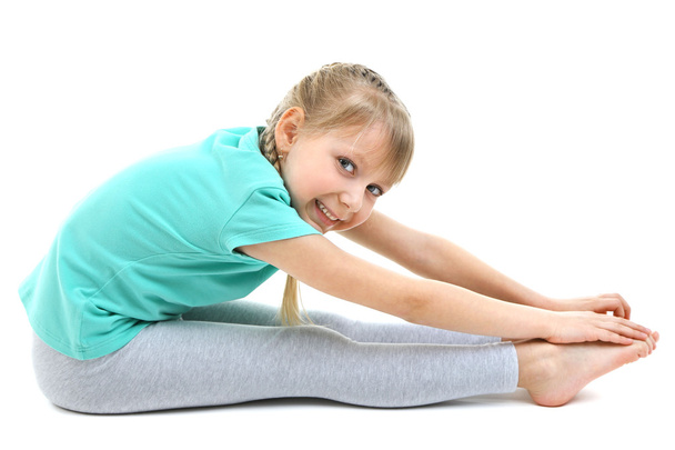 Little girl doing exercises - Fotó, kép