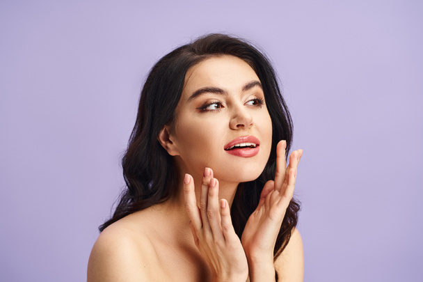 Woman with hands on face, applying makeup - Photo, Image