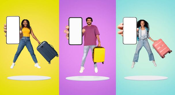 Happy Multiethnic People Jumping With Luggage And Showing Big Blank Smartphone At Camera, Cheerful Group Of Tourists Having Fun On Platform Over Bright Backgrounds, Recommending Booking App, Mockup - Photo, Image