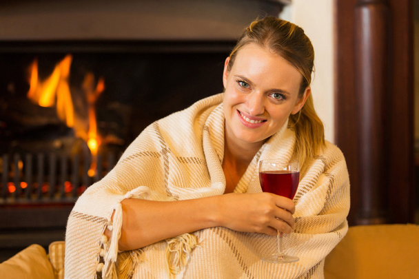 young woman drinking red wine at home - Foto, afbeelding