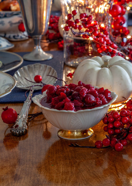 Cranberry sauce on a holiday table with duck, cranberry sauce and fine China. - Photo, Image