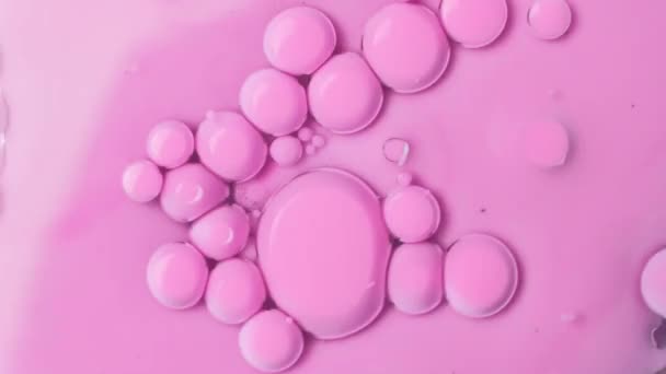 Pink bubbles of paint on an oil surface. Acrylic paint. Fantastic hypnotic surface. - Footage, Video