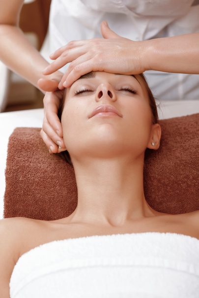 Beautician makes face massage - Fotó, kép