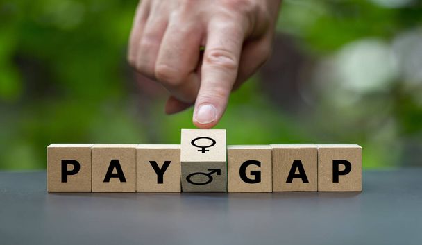 Wooden cubes form the expression 'pay gap'. - Photo, Image