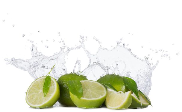 Limes with water splashes on white background - Photo, image