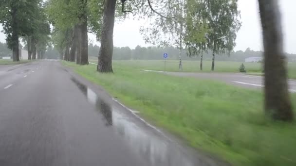 Rain fall on car automobile windscreen drive on road - Footage, Video