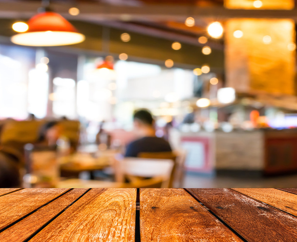 Empty wood table and Coffee shop blur background with bokeh imag - Photo, Image