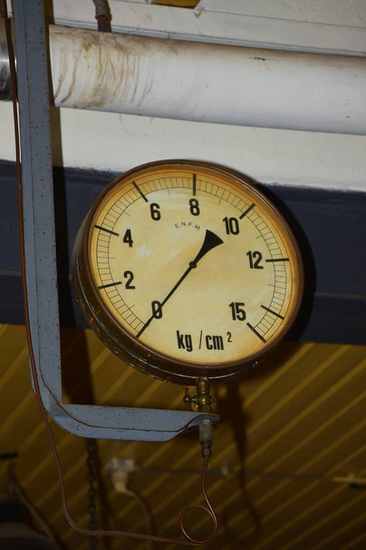 Medemblik, Netherlands. February 28, 2024. Elements and gauges of an old steam engine. High quality photo - Photo, Image