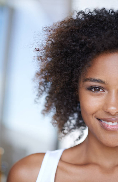 Half, face and black woman with beauty and happiness from dermatology and natural glow on skin. African, girl and portrait of skincare, cosmetics or hair care for curly afro hairstyle closeup. - Photo, Image