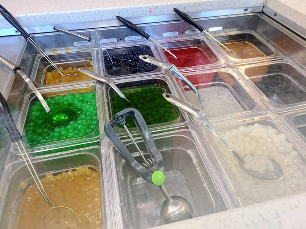 Diverse toppings at a bubble tea station in a Muncie, Indiana restaurant, 2023 - Photo, Image