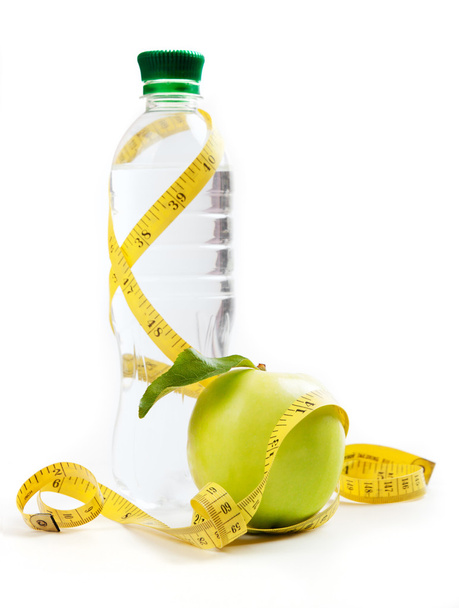 Apple core, bottled water for healthy life over a white background - Foto, immagini