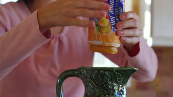 Woman makes orange juice - Video