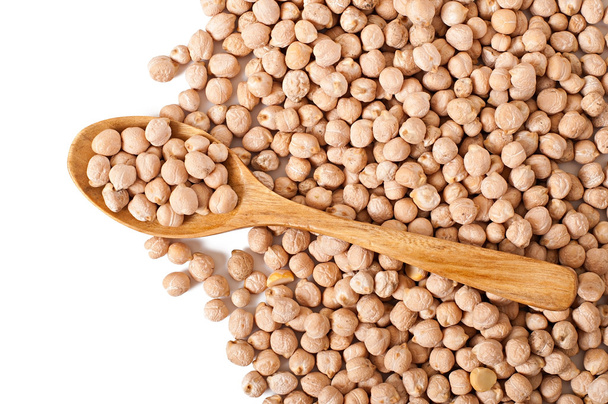 Uncooked chickpeas in wooden spoon - Photo, Image