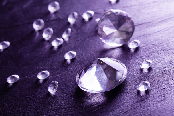Different diamonds with purple light - Foto, immagini
