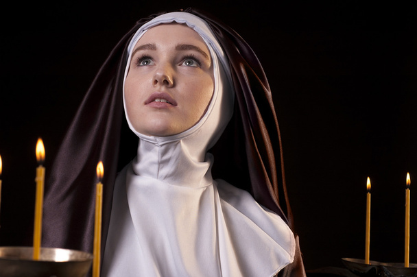 Nun with candles. - Fotoğraf, Görsel