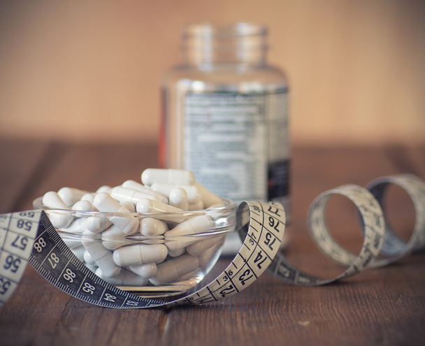 Voedingssupplementen in capsules en tabletten - Foto, afbeelding