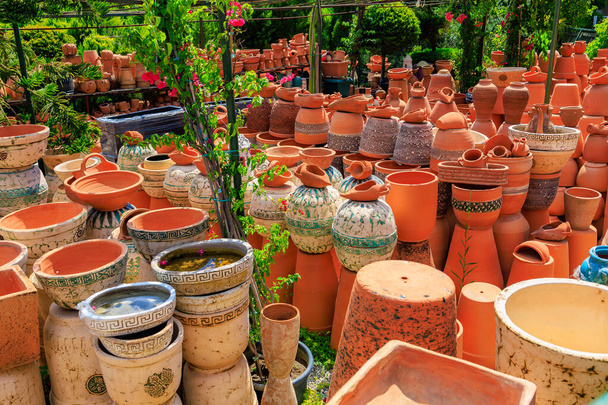 Clay products from pottery production. Background with selective focus and copy space for text - Photo, Image