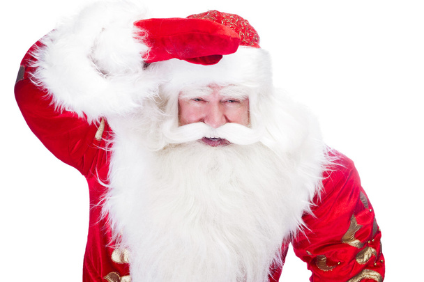 Traditional Santa Claus looking for children and holding his han - Photo, Image