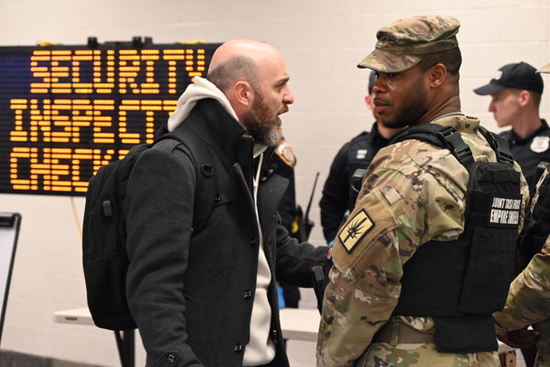 March 7, 2024, Manhattan, New York, USA - National Guard, MTA Police, New York State Police search luggage of subway riders at 34th StreetPenn Station in Manhattan, New York.   - Photo, Image
