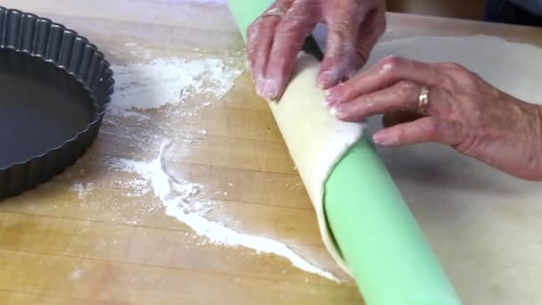 Woman placing dough - Filmati, video