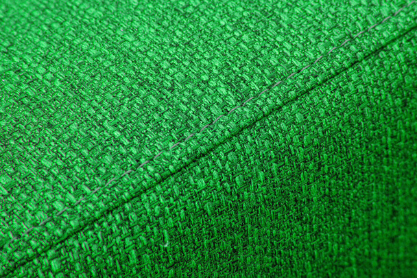 Υφασμένο πράσινο ύφασμα επίπλων με ραφές close-up - Φωτογραφία, εικόνα
