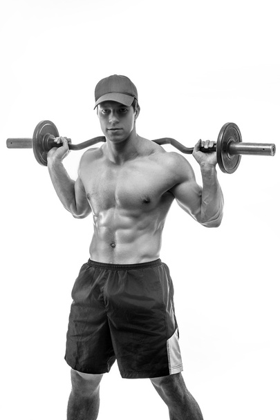 Muscular guy holding barbell - Photo, Image