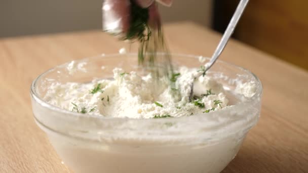Dill is added to sour milk cheese - Footage, Video
