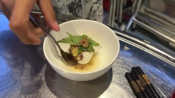 Egg with embryo Vietnamese delicacy. Balut boiled developing duck embryo in Hoi An, Vietnam. special cuisine in Asian countries. - Footage, Video