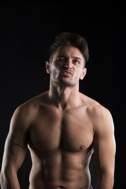 Handsome muscular, shirtless man looking up - Valokuva, kuva