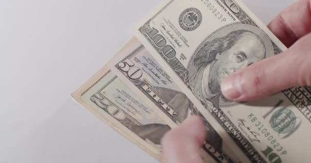 Footage of almost all US dollar bills being counted by hand. All US dollar bills in hand. Hundred USD cash macro view. Dollar Cash Stop Motion. Stop Motion of 1,5,10,20,50, 100 USD Bills. - Footage, Video