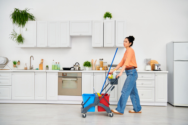 A stylish woman effortlessly pushes a shopping cart in a sleek kitchen, showcasing effortless style and grace in household chores. - Photo, Image