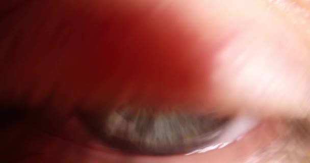 Human eye is light green. Vision correction technique, cataract and optical illusion concept - Felvétel, videó