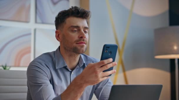 Happy office worker reading smartphone message in cabinet closeup. Successful manager smiling taking good news browsing mobile phone. Cheerful businessman satisfied by company work feeling success  - Footage, Video