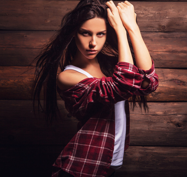 Young sensual & beauty woman in casual clothes pose on grunge wooden background. - Zdjęcie, obraz