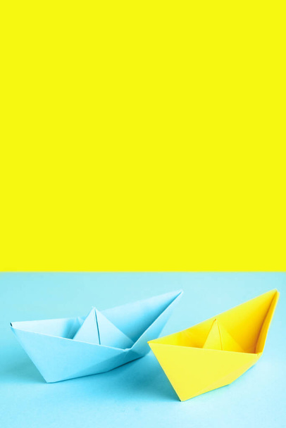 Colorful origami boats on color background - Photo, Image