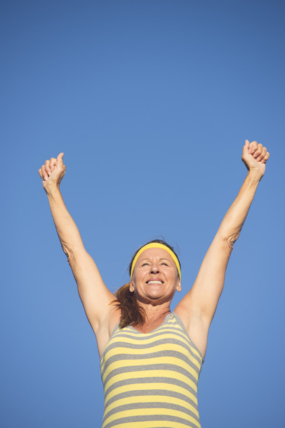 Successful fit healthy retired woman arms up - Foto, Imagen