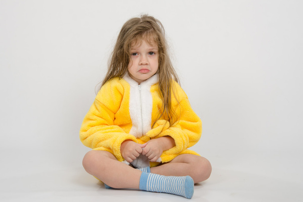 Offended girl in yellow bathrobe - Photo, Image
