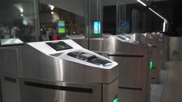 Turnstile for passage and fare payment in Italy, Rome station at airport. Contactless payment for train fare. Entrance gate with fare validation at railroad station in Europe. Transport payment system - Footage, Video