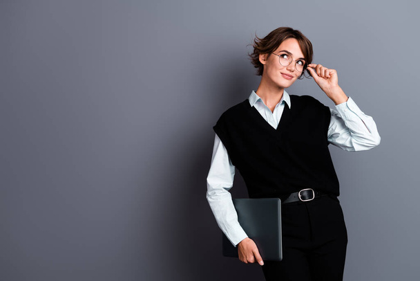 Photo of stunning confident woman professor dressed stylish black clothes looking empty space news isolated on grey color background. - Fotoğraf, Görsel