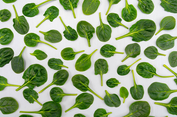 Fresh green baby Spinach leaves, diet and healthy food concept, weight loss, spinach background top view - Photo, Image