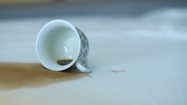 cup of coffee spilled on a bed , - Footage, Video