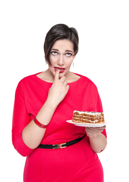 Beautiful plus size woman temptating with cake - Fotografie, Obrázek