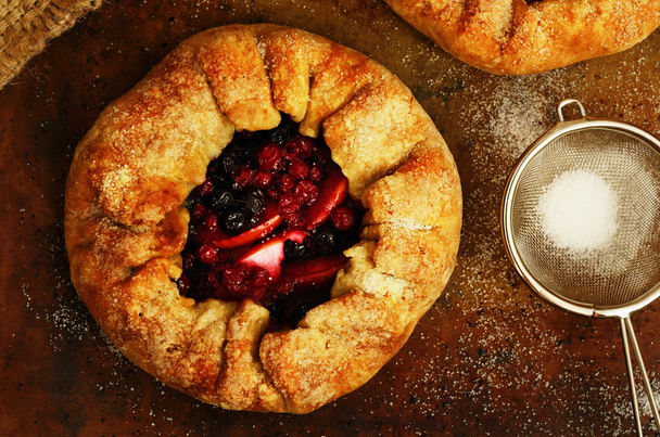Homemade open pies or galette with apples and berry mix - Photo, Image