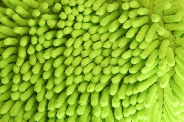 Fondo verde del guante de la esponja
 - Foto, imagen
